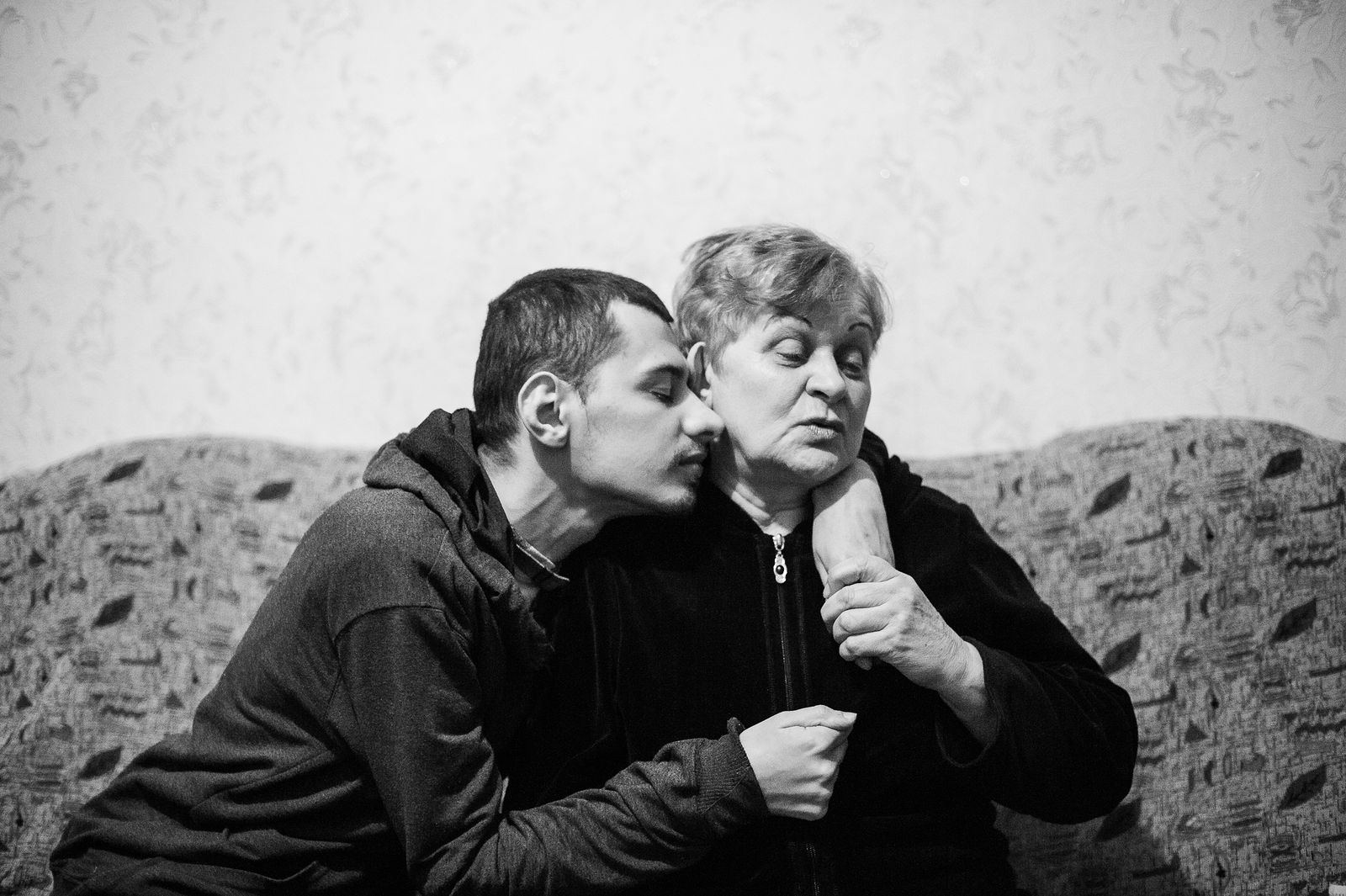 Arik Shraga. "Joint" Families: The Stories of Love. Transnistria, Rybnitsa. Stepan and his mother Stepan was born healthy but just a few minutes after birth a nurse dropped him on the floor which made him disabled for the rest of his life. He can’t talk.
During a few recent years Stepan’s mom, Lyudmila, has lost her elder son, granddaughter, husband and mother-in-law. However, she is strong enough to consider herself a happy person after all these tragedies. She has nothing left but her son and their unconditional and mutual love outweighs everything that’s missing.