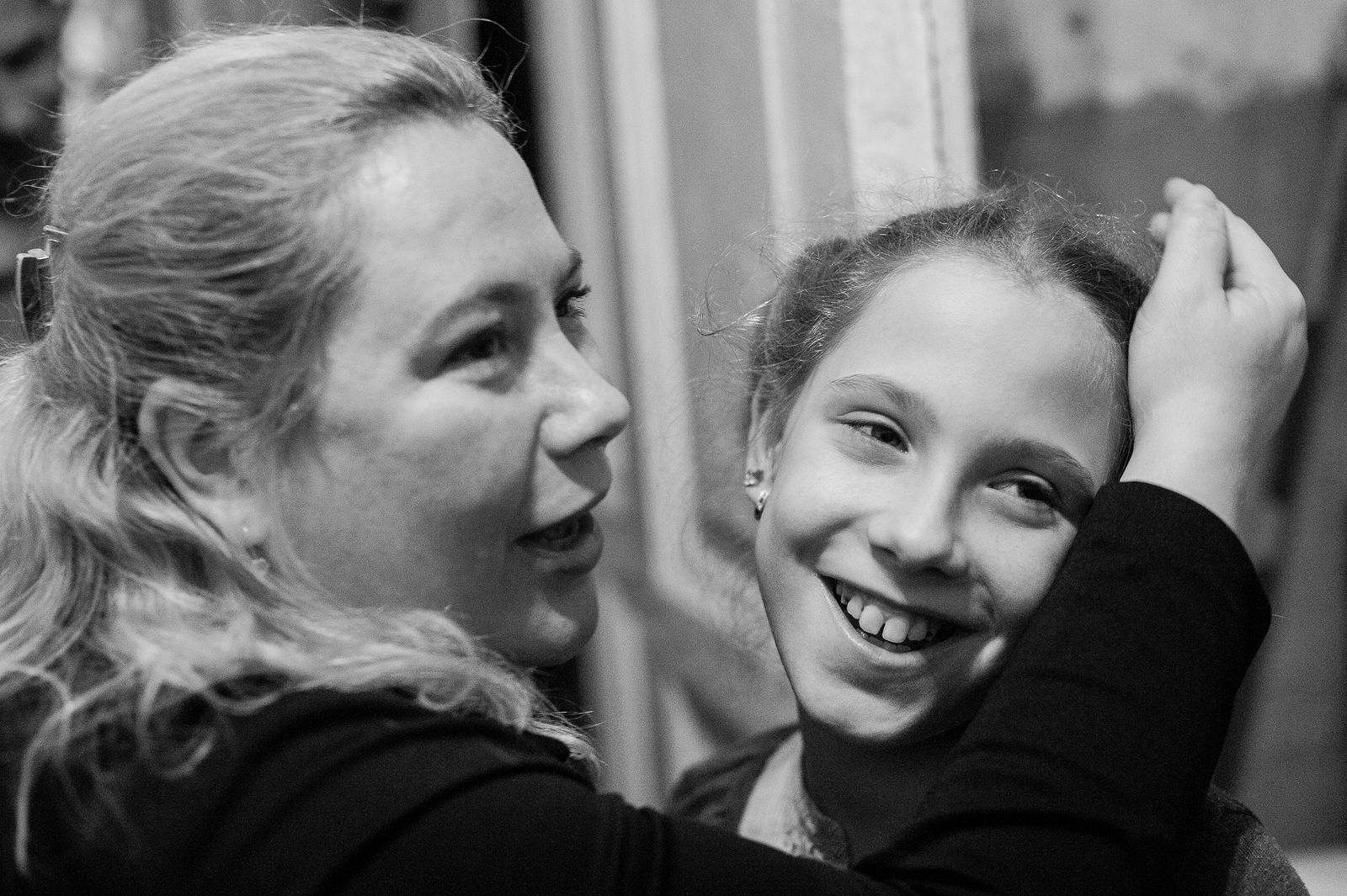 Arik Shraga. "Joint" Families: The Stories of Love. 2016. Ukraine, Odessa. Lera and her mother I revisited Lera three years after I first met her. The family is doing great. JDC helped to renovate the flat, Lera’s father recovered from his burns, and Lera is flourishing at school and at a theatre studio. The atmosphere was the opposite to the one of 2013. Now there was a lot of laughs, hopes, conversations about the future and dreams. Laughing, Lera’s mother remembers the moment when I came in 3 years ago: it was right after the fire happened, and she was completely disoriented and her life seemed to be a mess. "The fire happened late at night, and in the morning I didn’t find anything better than to go to work, as if nothing happened". She works a nurse at a children’s hospital. "Only when colleagues noticed a smell of smoke coming from my clothes they wondered what happened. They told me to go home and take care of the situation. But how was I supposed to take care of it? Where to run, where to live, what exactly to do? I had no idea". And in this situation again good people were able to help: so long as it was impossible to live in their flat, she was offered to stay for free at a hostel belonging to the hospital she was working at.