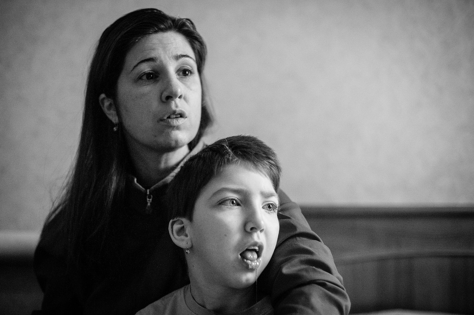 Arik Shraga. "Joint" Families: The Stories of Love. Cheljabinsk. Yulia and her mother Yulia’s mother tells: "When Yulia was born with severe cerebral palsy, the hospital staff as well as my own parents were trying to convince me that I should abandon her, since she has no chances to recover anyway. I couldn’t imagine myself enjoying life knowing that I’ve abandoned my baby. How would I even have tasty meals knowing that she’s somewhere with strangers? I kept Yulia with me, and now enjoying my life with her. Afterwards I gave birth to 2 more kids, who are healthy and who truly love their elder sister. Surprisingly, also my husband and his parents turned out to be much more understanding and supportive than my own mom and dad. I live with my in-laws, and they help me a lot".