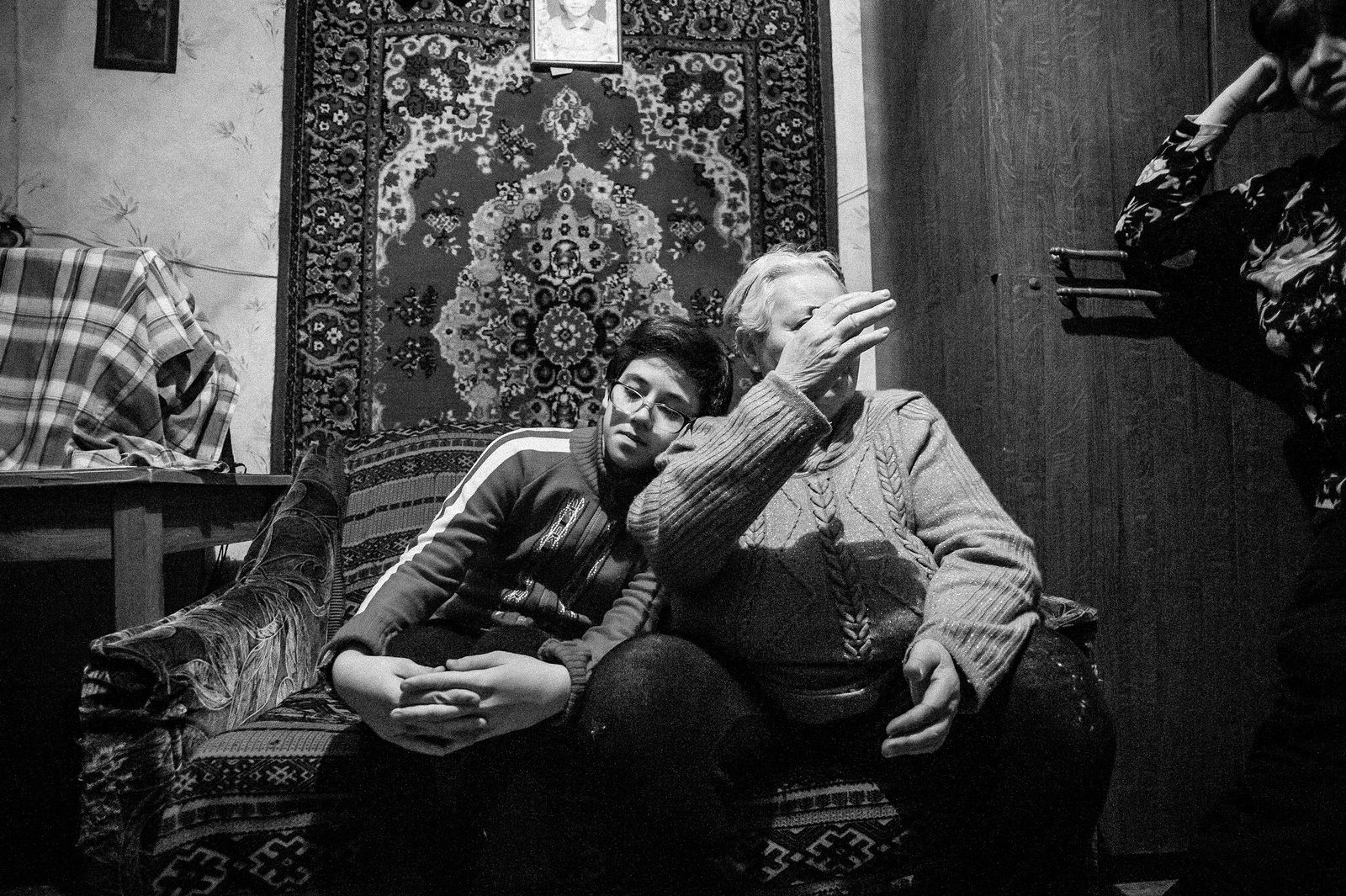 Arik Shraga. "Joint" Families: The Stories of Love. Cheljabinsk. Tolya with his family Tolya is surrounded with love and care provided by 2 women: his mom and granny. He’s got a classical Jewish grandmother who says "But I poorly sustain flights!" when I suggest that maybe some day Tolya will participate in Na’ale or some other educational program in Israel. She can’t imagine even a day without her sweet grandson. Tolya has no father or grandfather.
He adequately responds to care and love by being attentive and tender child. He used to study at a Jewish school and was among its best students, the rabbi has personally installed mezuzot in his flat. Sadly, the school was closed down last year and he had to change comfortable environment of a small class of Jewish mates for a standard class of a standard school. Surprisingly, it didn’t cause problems. Tolya is still one the best students and he still feels comfortable with his new classmates.