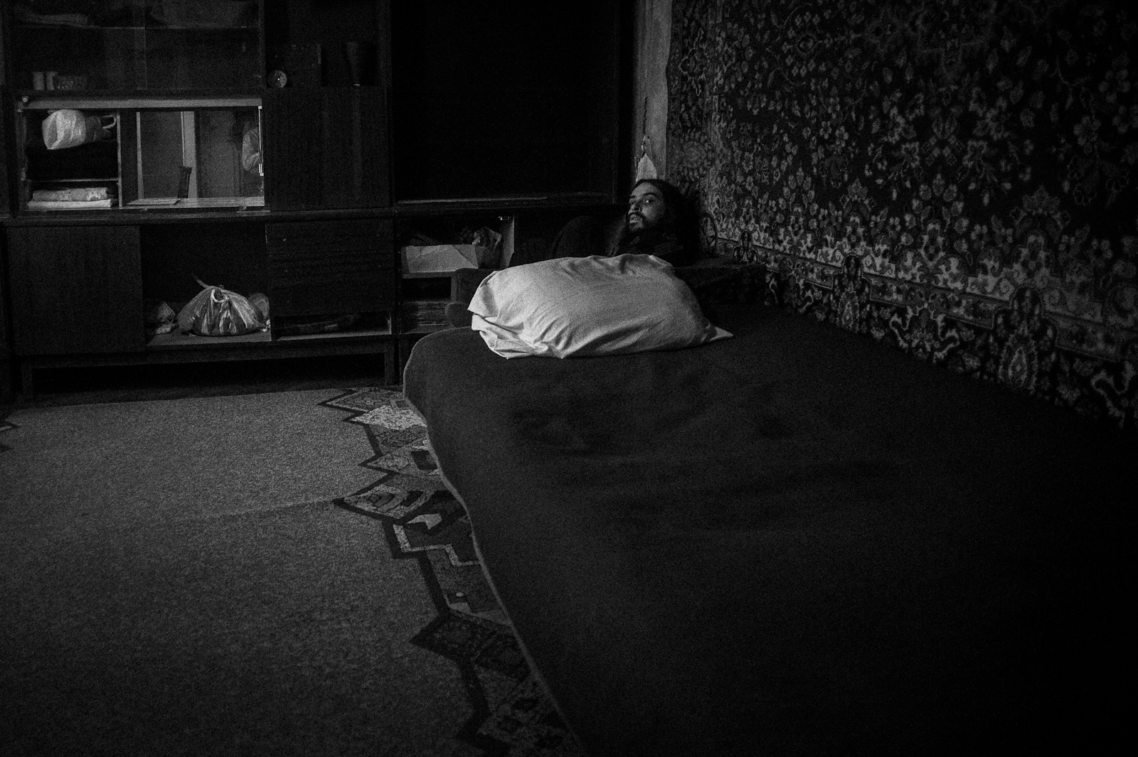 Arik Shraga. Moldova. Chishinau. Ilya Ilya suffers from autism. He hides himself in an armchair in the corner of the room and spends there most of the time.