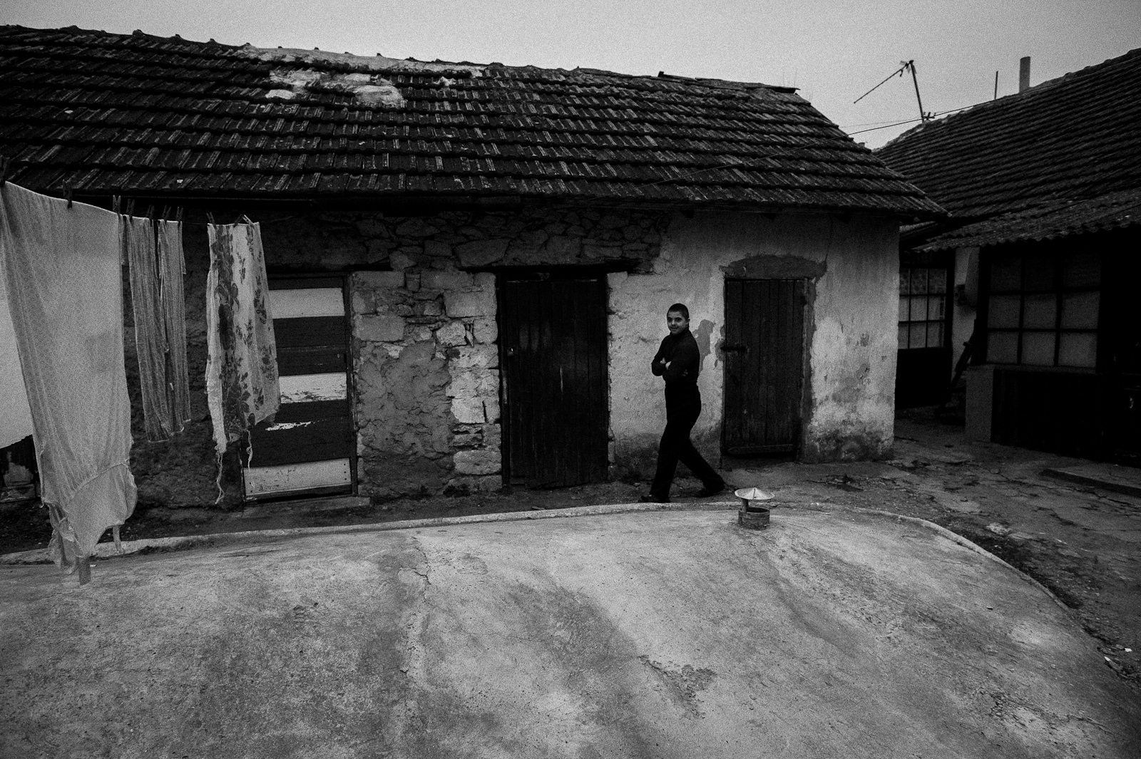 Arik Shraga. Moldova. Orhei. Sergei Sergey suffers from Down syndrome. He lives in awful conditions in a house without even a toilet but he’s surrounded by love and care of his parents and elder sister.