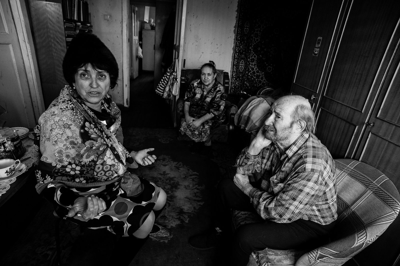 Arik Shraga. Russia. Ural region. Yekaterinburg The family consists of 2 disabled persons, father and daughter. On this picture a "Menora’ curator paying visit to her clients is shown